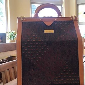 Large Escada travel bag. Outside is in great condition. Inside is peeling.